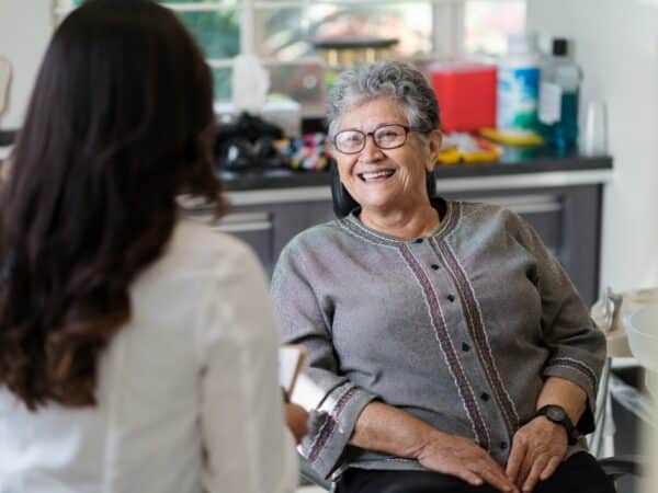 Doctor consults with patient in modern office.