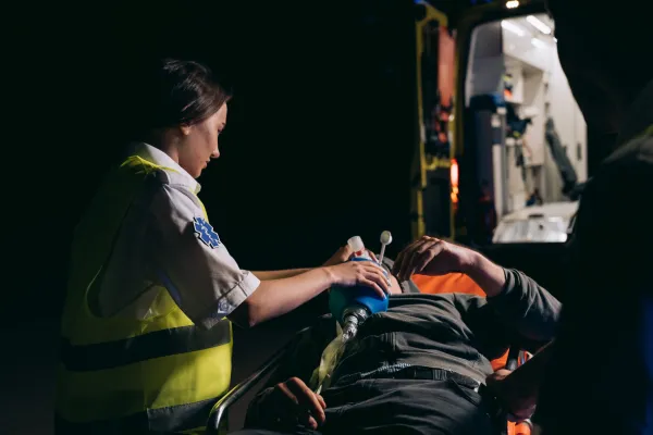 First responder sitting alone showing emotional exhaustion behind a strong exterior.