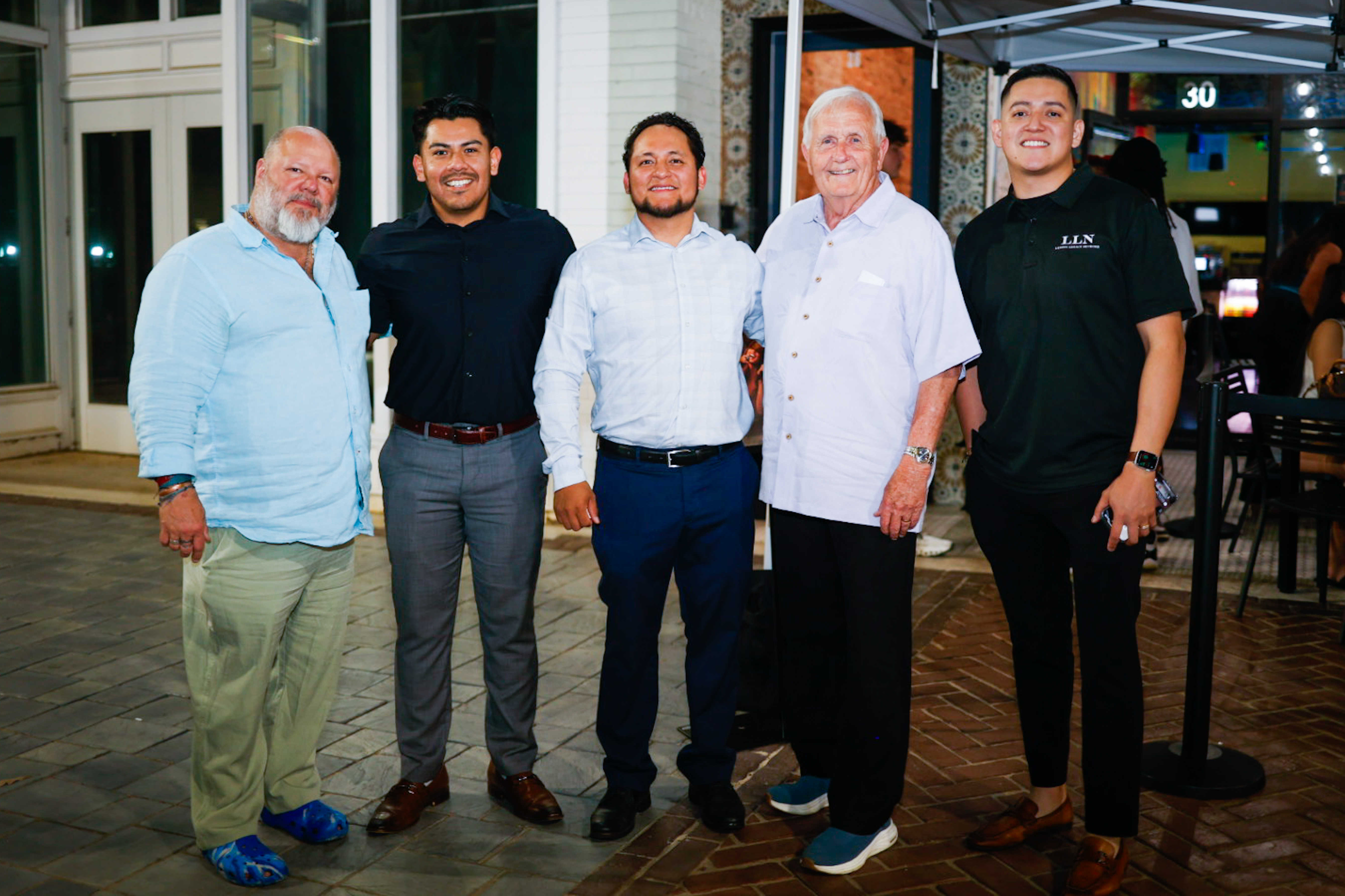 Latino small business owner working in a warm, everyday restaurant/shop setting in Charlotte