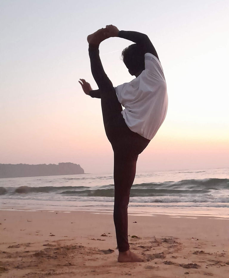 A person practicing yoga, displaying deep focus and strength.