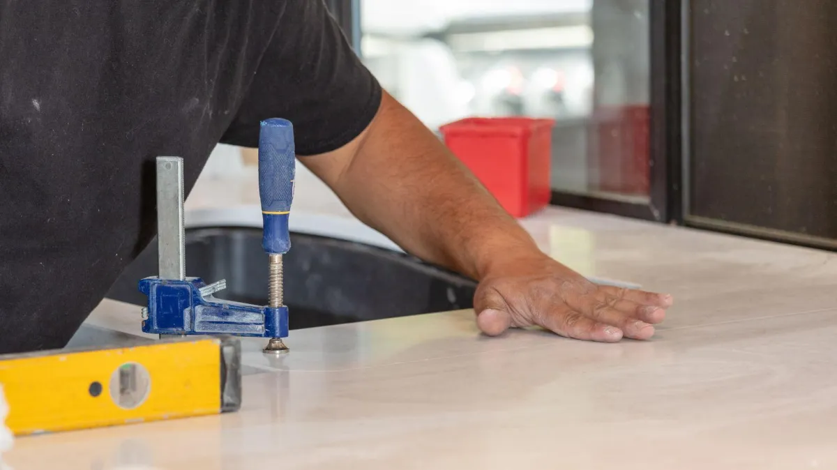 a bird flying over a snow covered ground