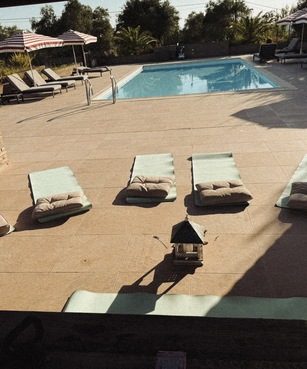 image of a yoga set up by the pool
