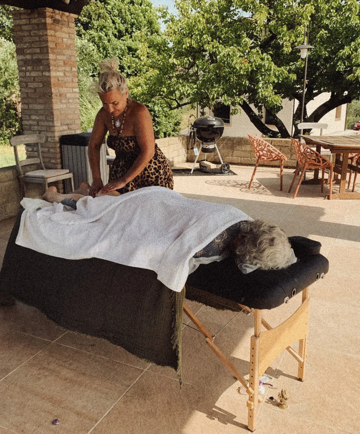 image of massage on a client by the pool side