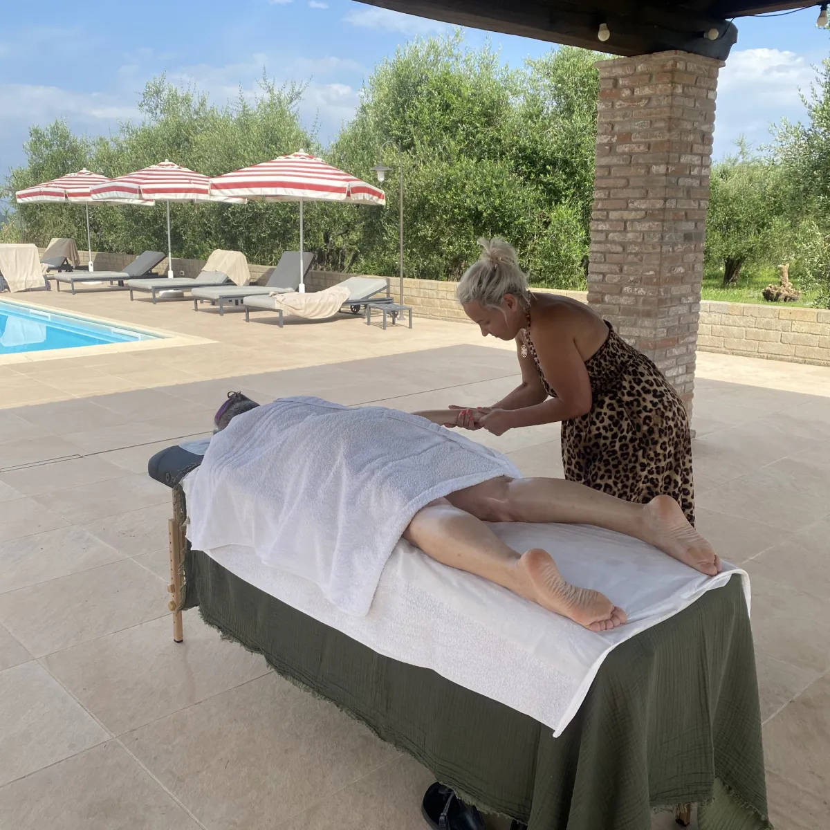 image of massage by the pool during the retreat