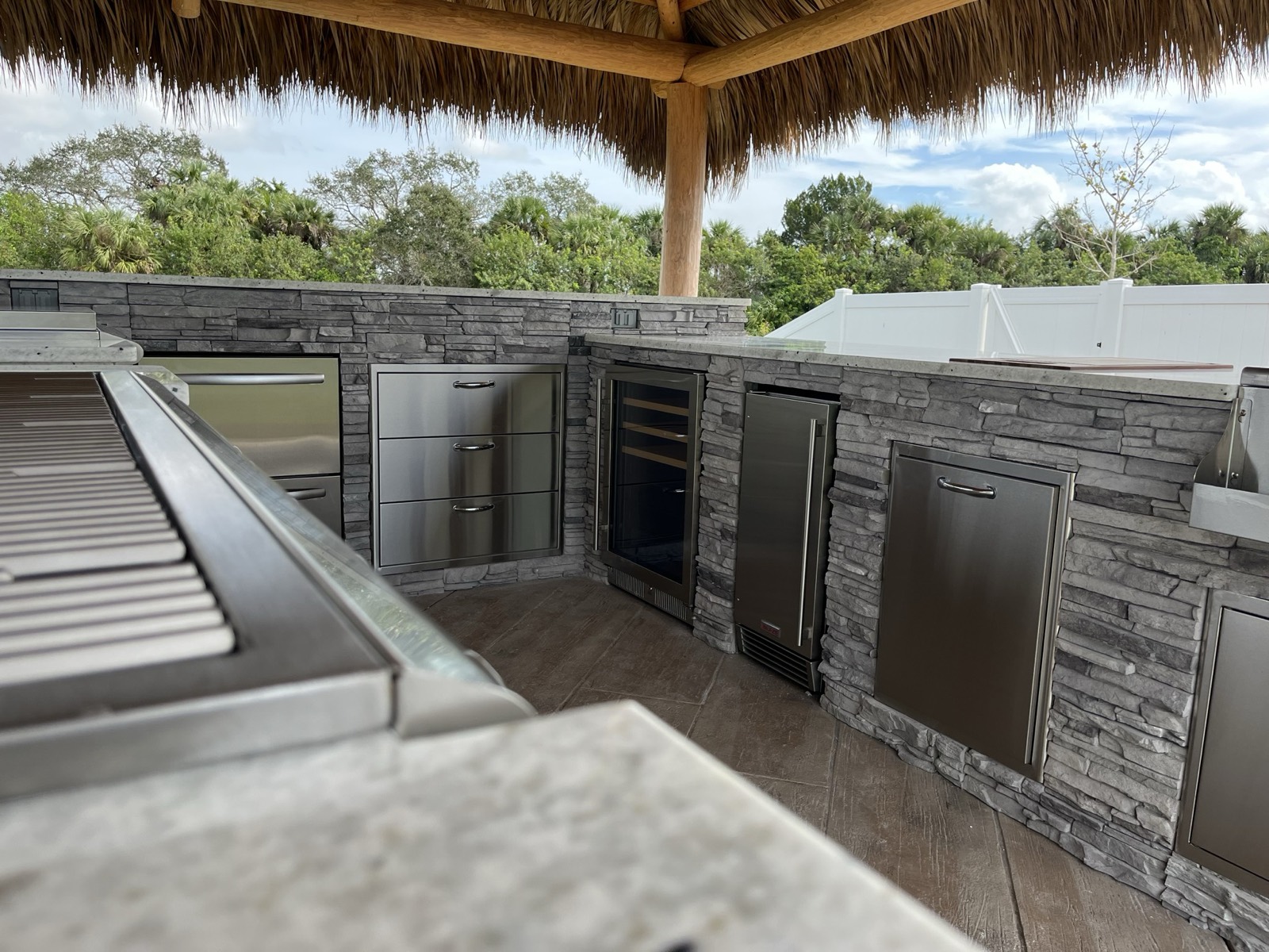 Waterside tiki-style outdoor bar built by Endless Summer