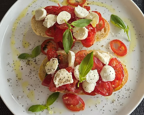 Homemade bruschetta with zucchini topped with extra virgin olive oil at Taste Italian Nottingham