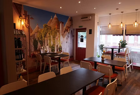 Inside Taste Italian - intimate dining area with tables and chairs in Nottingham's authentic Italian bistro