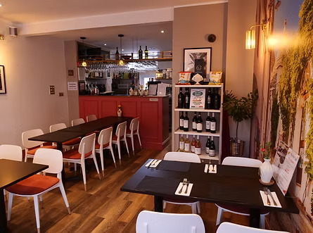 Taste Italian interior showing dining tables, wine display and counter at family-run Italian restaurant Nottingham