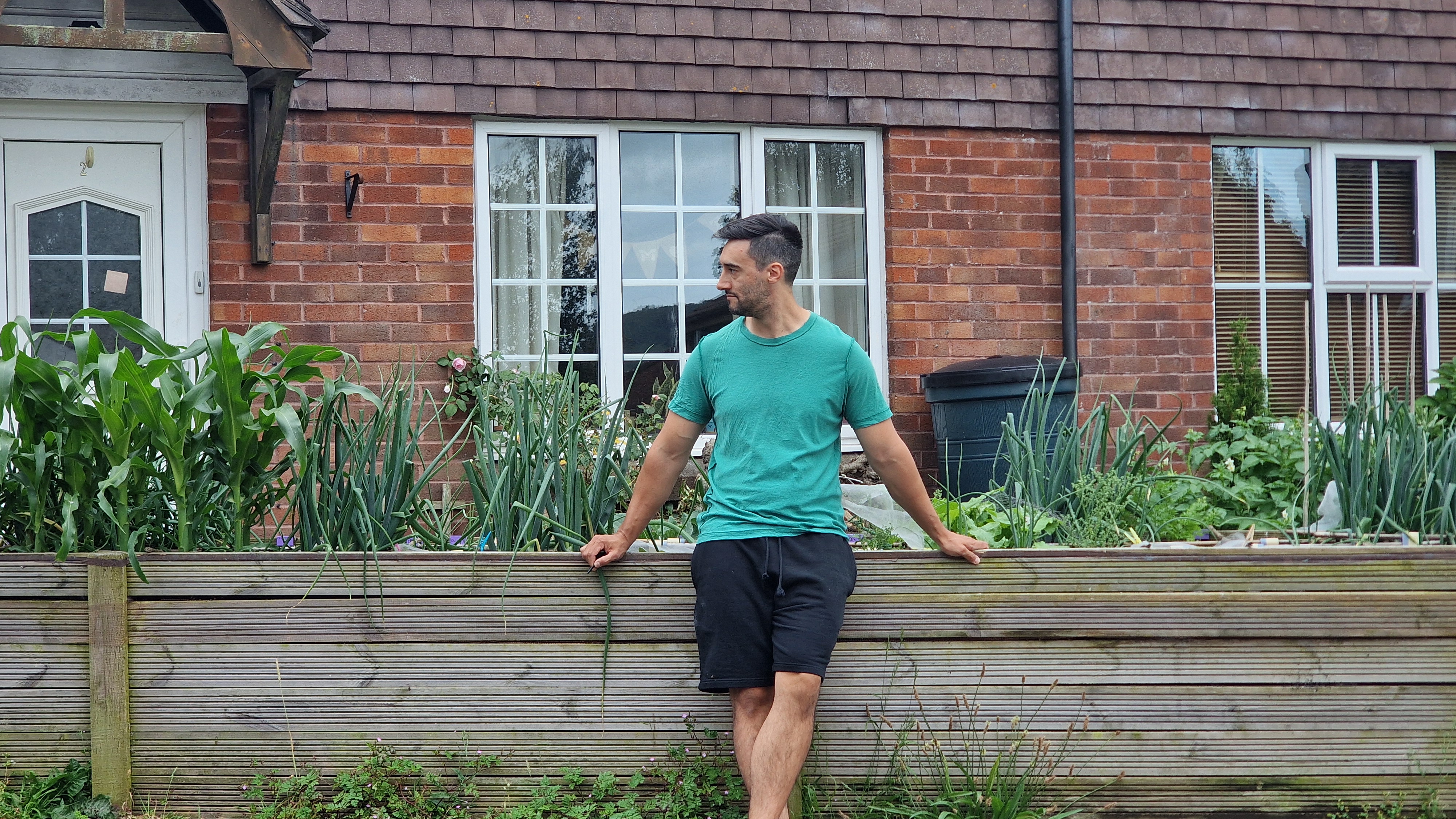 Mike in the square foot garden, beautifully framed
