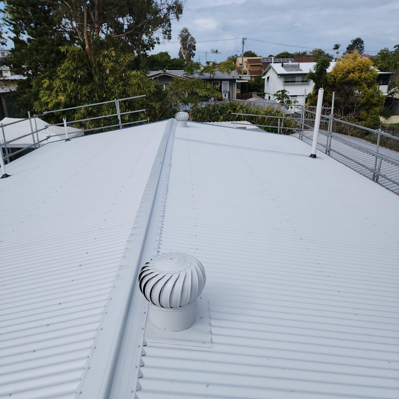 Roof ventilation system with whirlybirds and vents