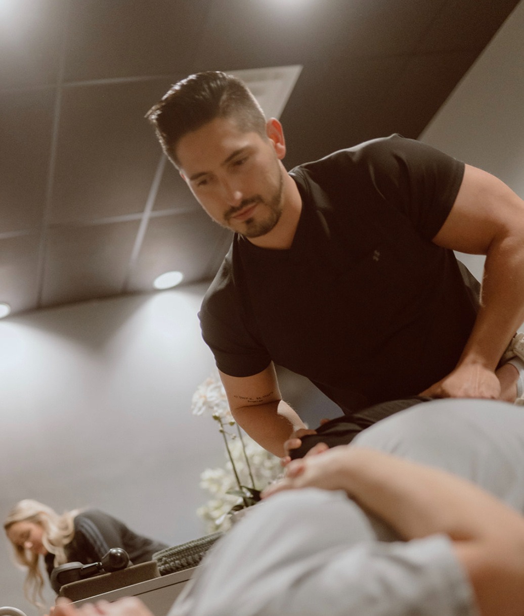 Athlete performing explosive movement prep guided by sports chiropractor