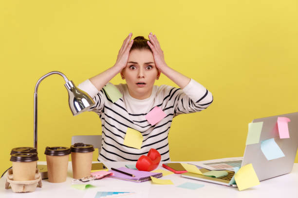 frustrated, overwhelmed woman trying to organize her business