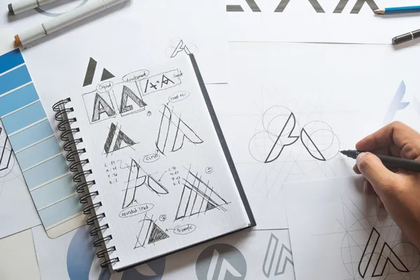 Various sketches of a company logo