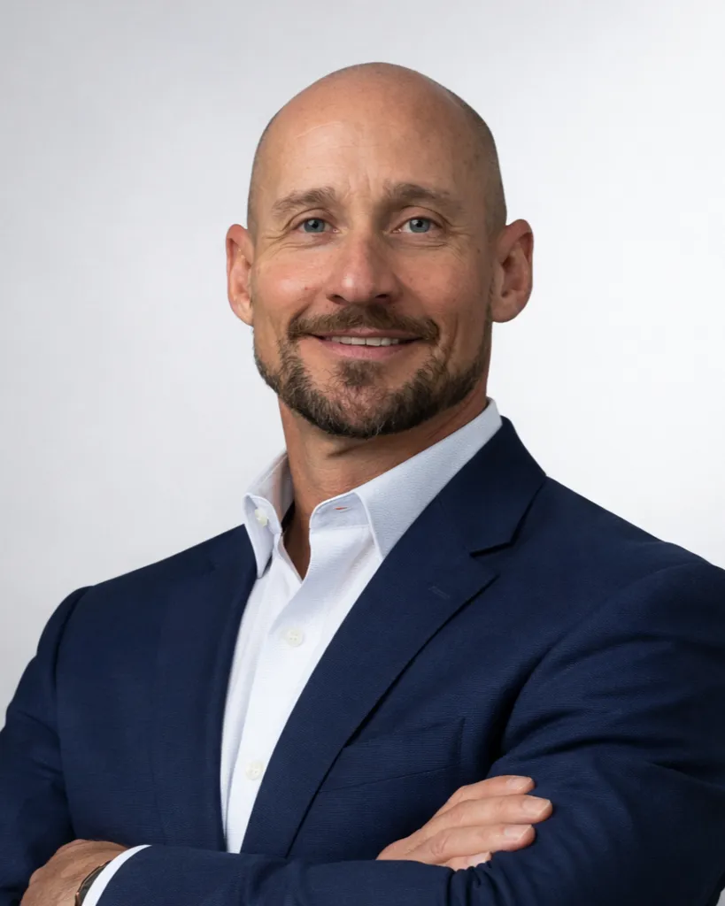 Formal executive portrait of the founder