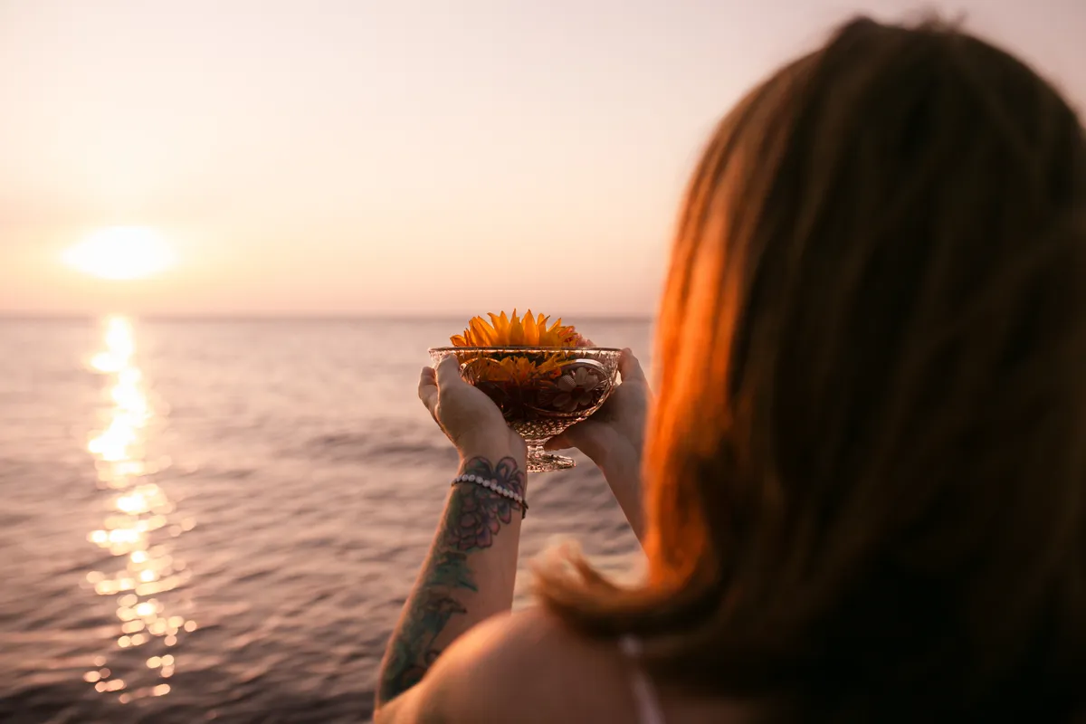 Melissa holding sacred spiritual guidance space with a client in an organic warm sunlit sanctuary