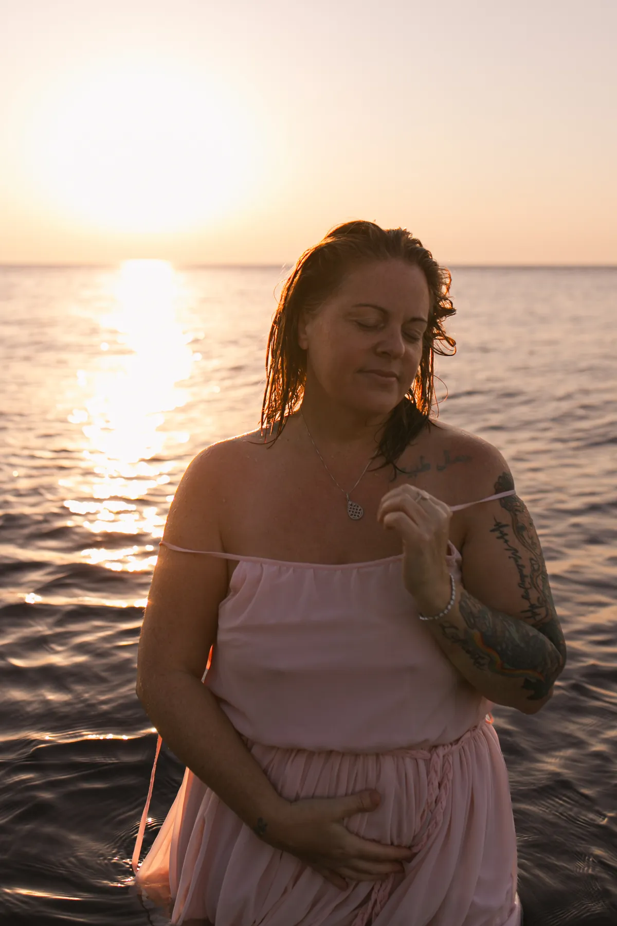 Melissa in a serene natural setting, embodying gentle grounded energy and warmth