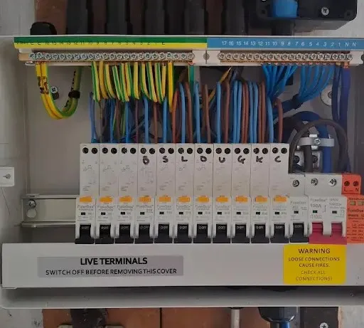 Neatly installed domestic consumer unit with organised electrical wiring and circuit breakers, illustrating Electro Virium Ltd's services