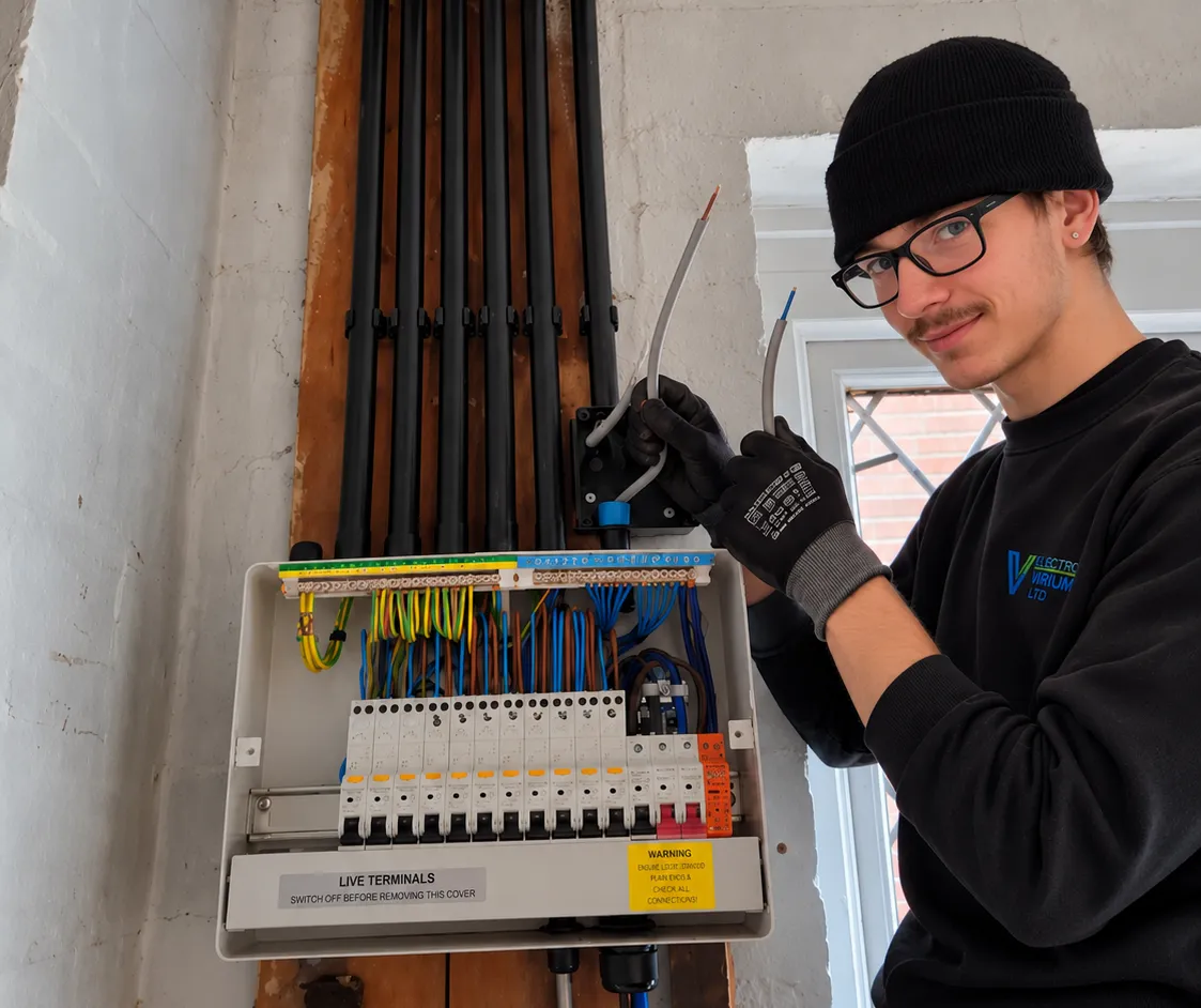 Max from Electro Virium Ltd working on a domestic consumer unit during an electrical installation in Macclesfield