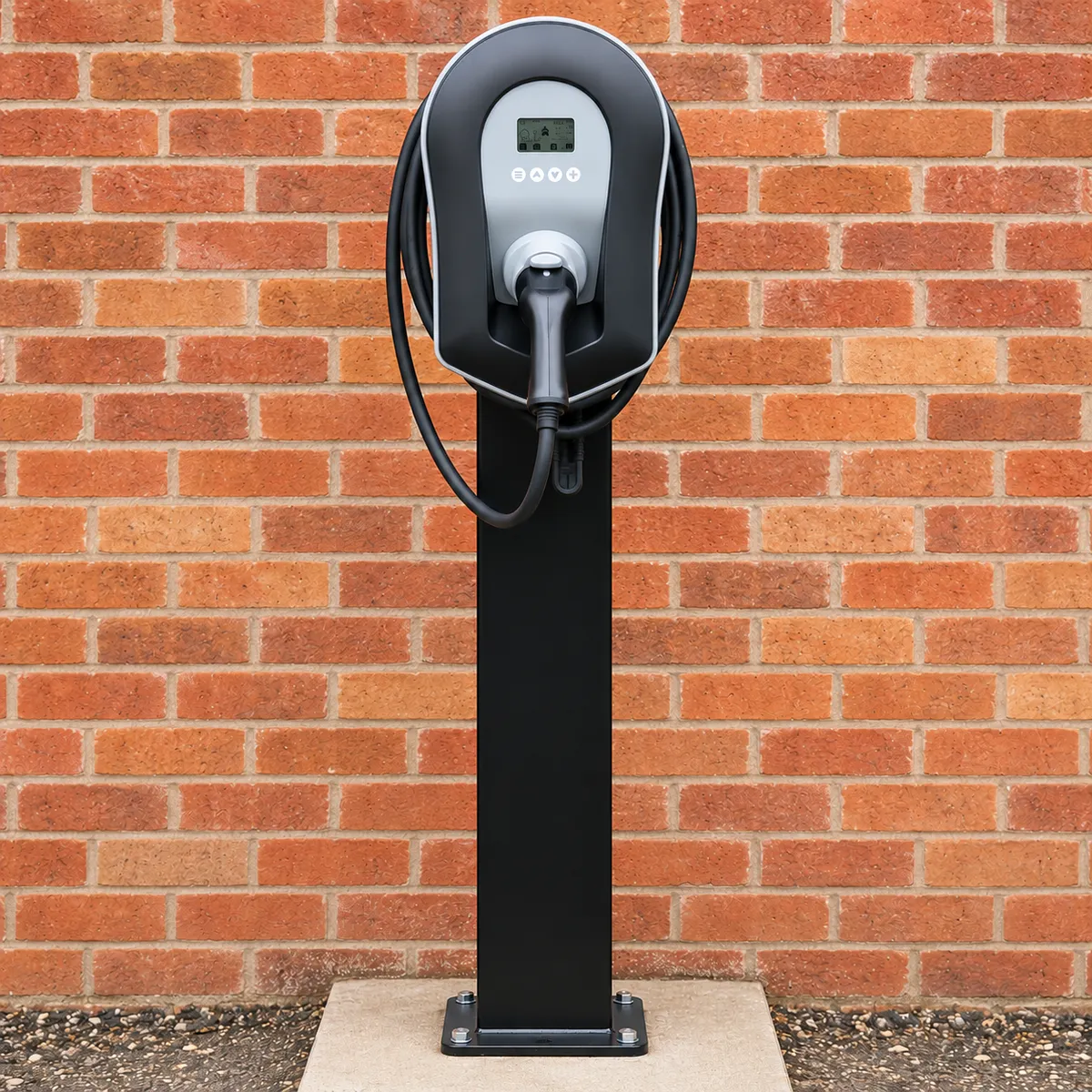 Commercial electric vehicle charging point mounted on a pedestal beside a brick wall, illustrating Electro Virium Ltd's workplace EV charging services