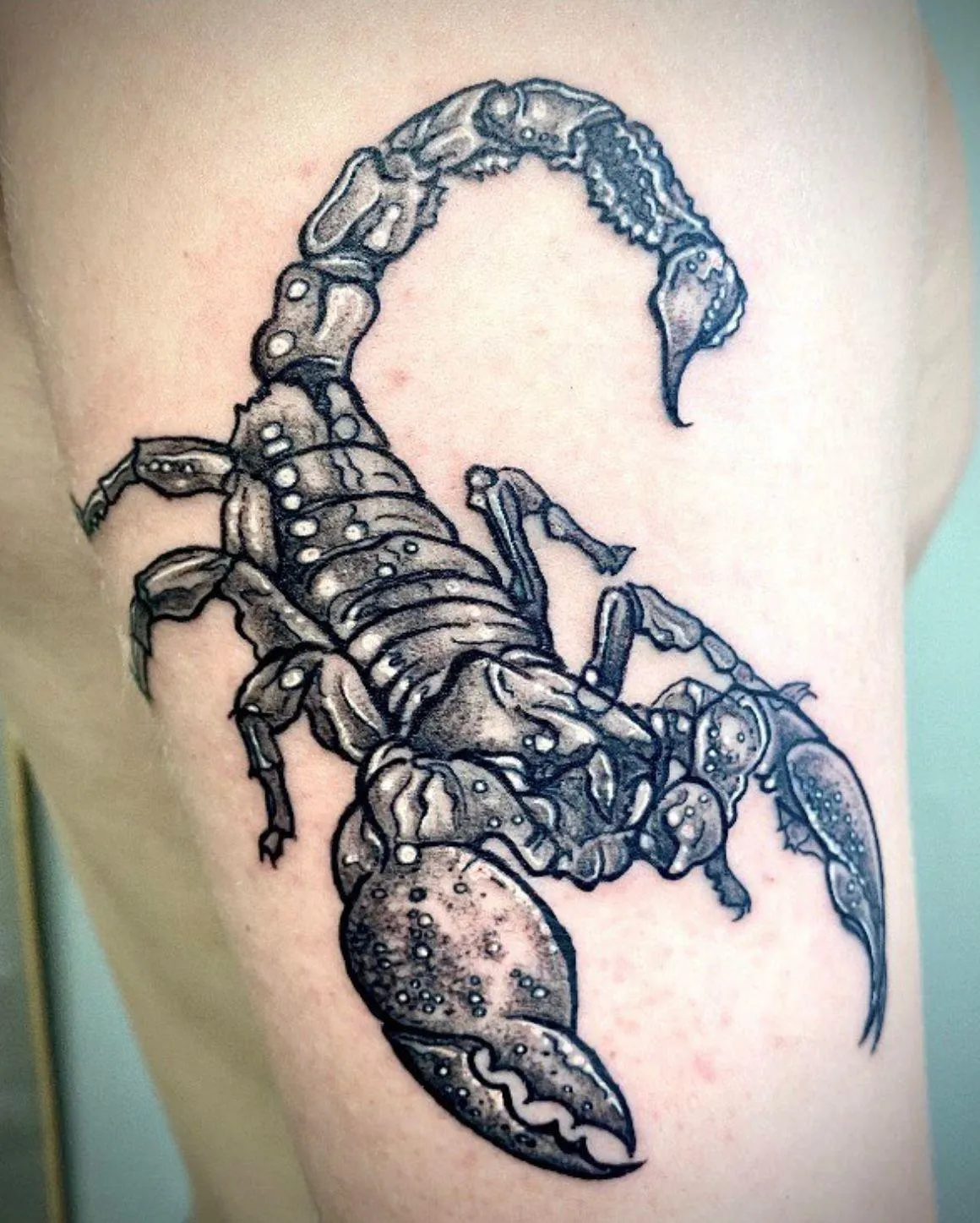 person in blue denim shorts and white nike sneakers standing on gray concrete floor