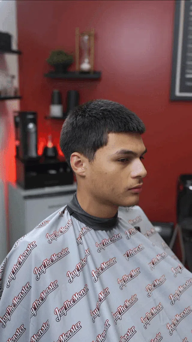 person holding white and gold hair comb