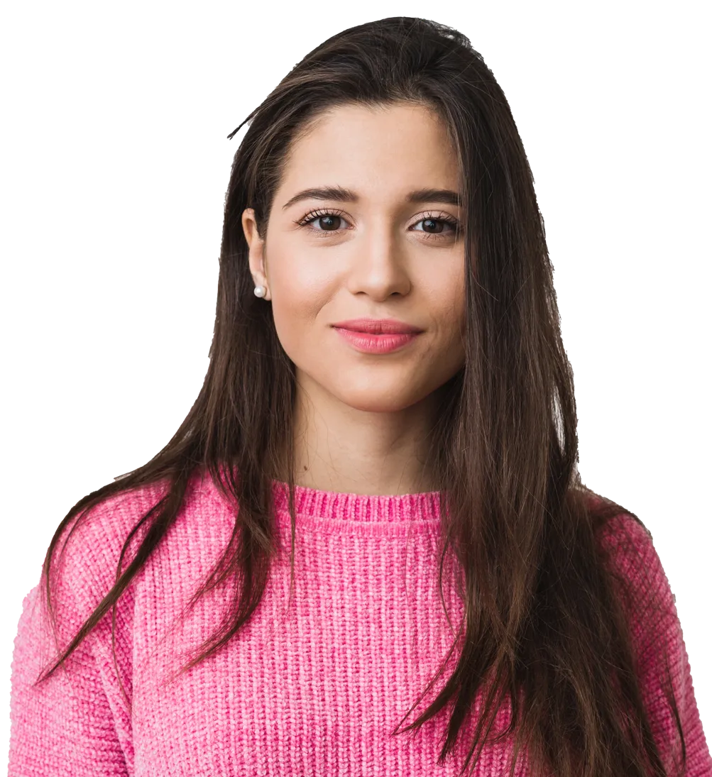 A young woman with long brown hair is looking directly at the camera with a slight smile. She is wearing a bright pink knitted sweater and pearl earrings. Her expression is calm and confident. The background is transparent, isolating the subject and making her the focal point of the image.