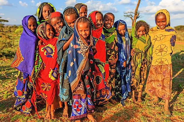 A group of African girls, gathered in the fields of Africa