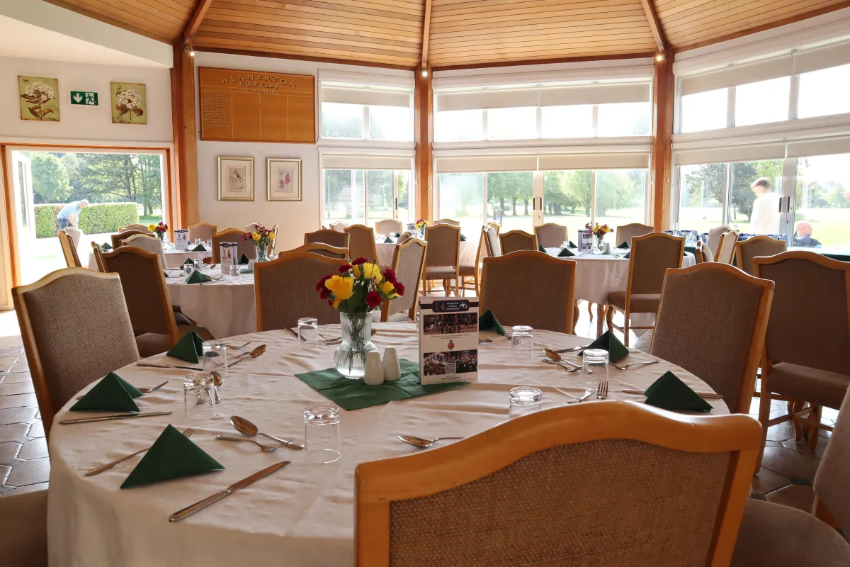 a person swimming in the water with grass