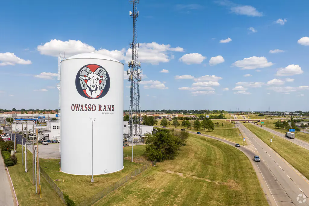 The Owasso water tower with the Owasso Rams logo, beside the highway in Owasso, Oklahoma