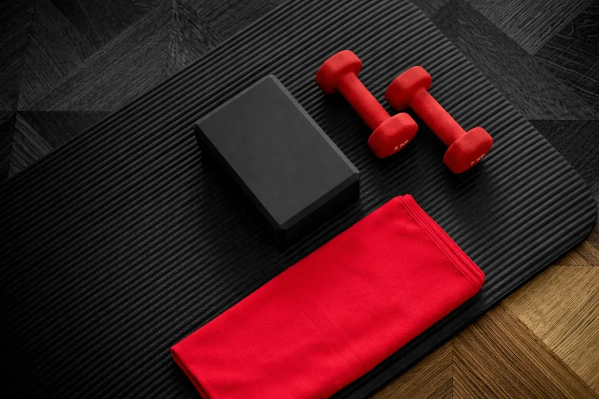 pink dumbbell on pink textile