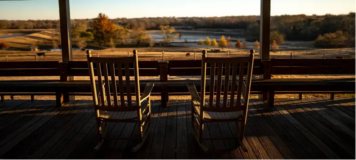 back porch with rocking chairs