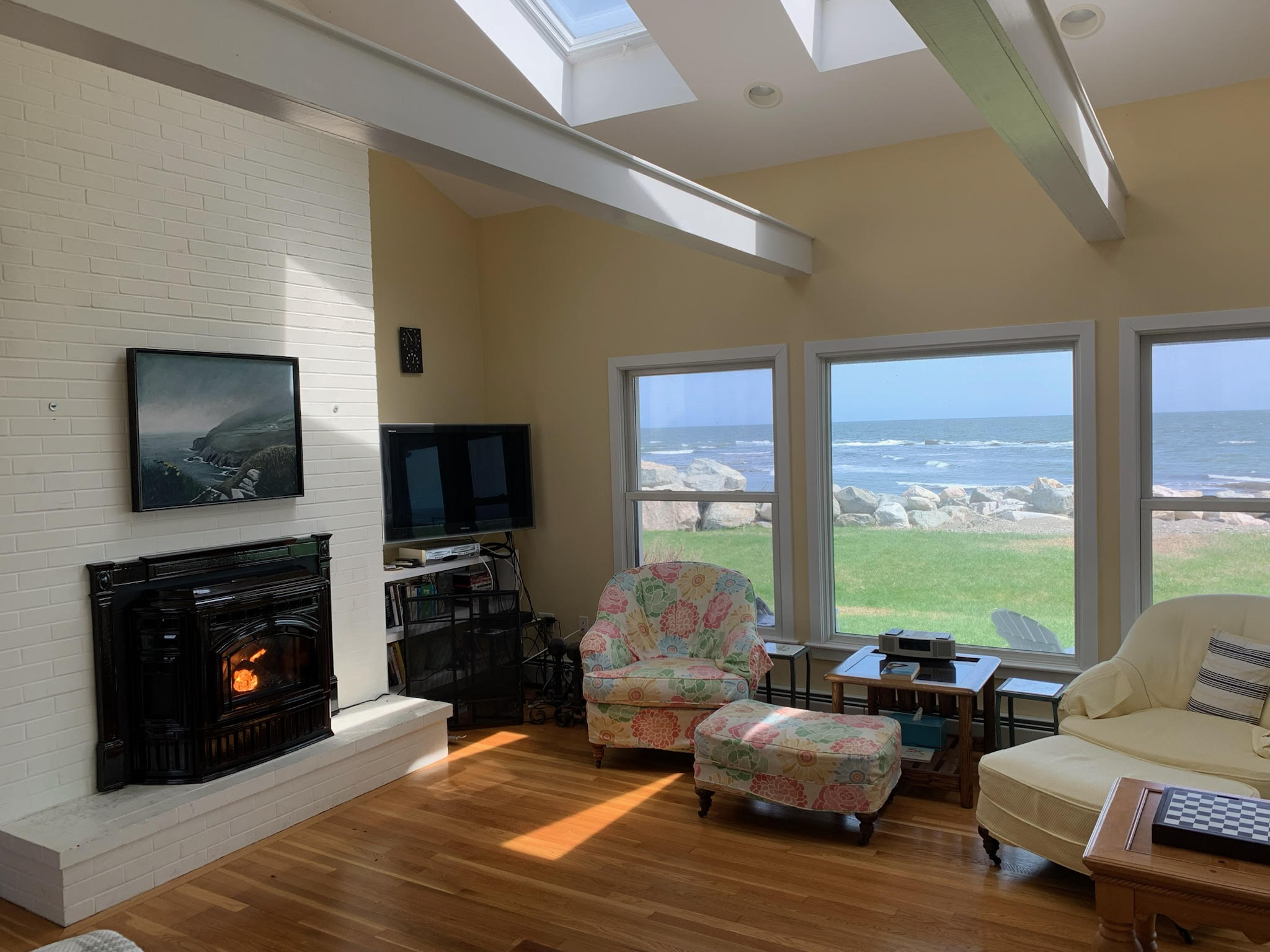 a living room filled with furniture and a fire place
