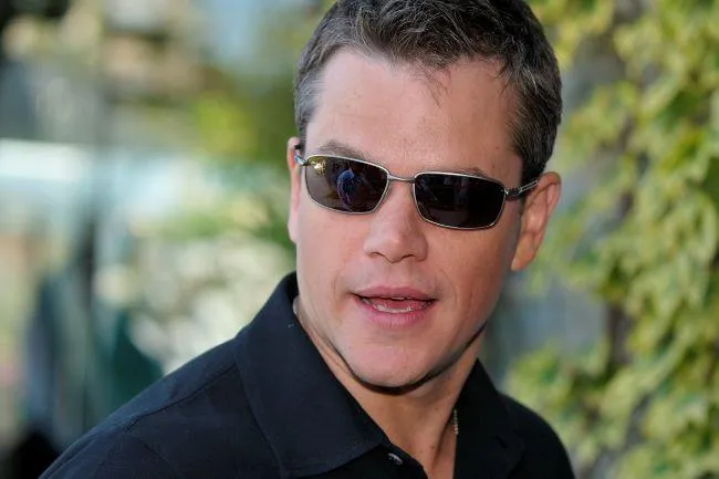 Matt Damon in dark glasses talking about how he quit smoking with hypnosis