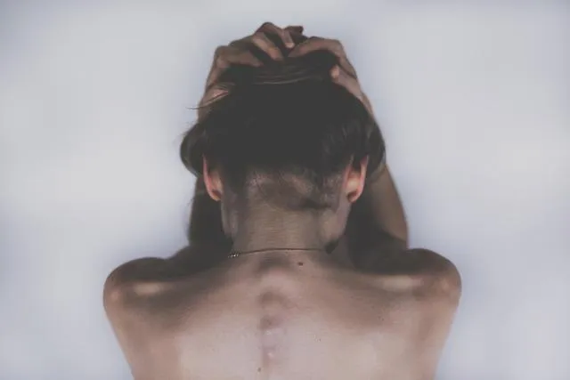 Hypnosis for pain relief — person in visible discomfort