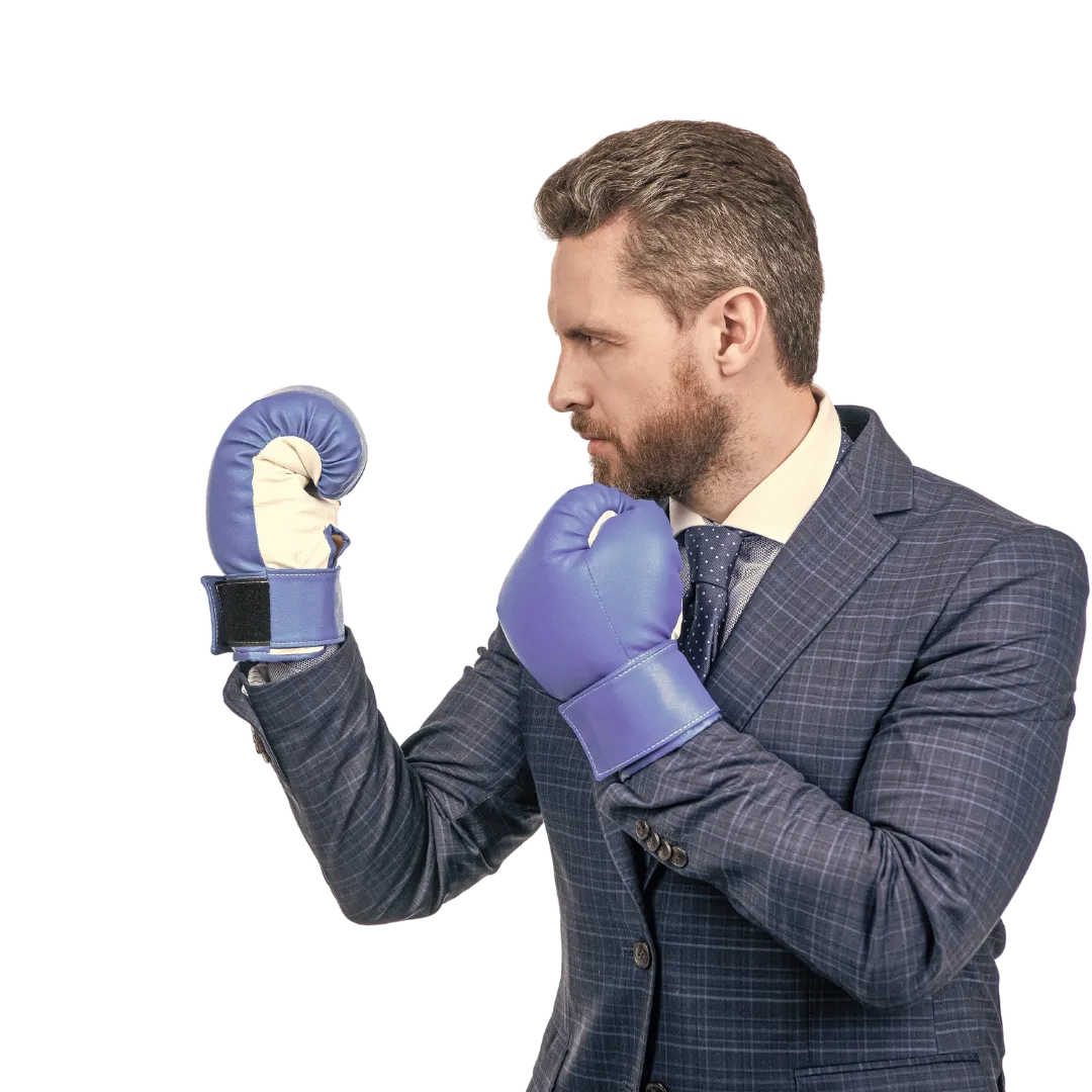 business man in suit wearing boxing gloves