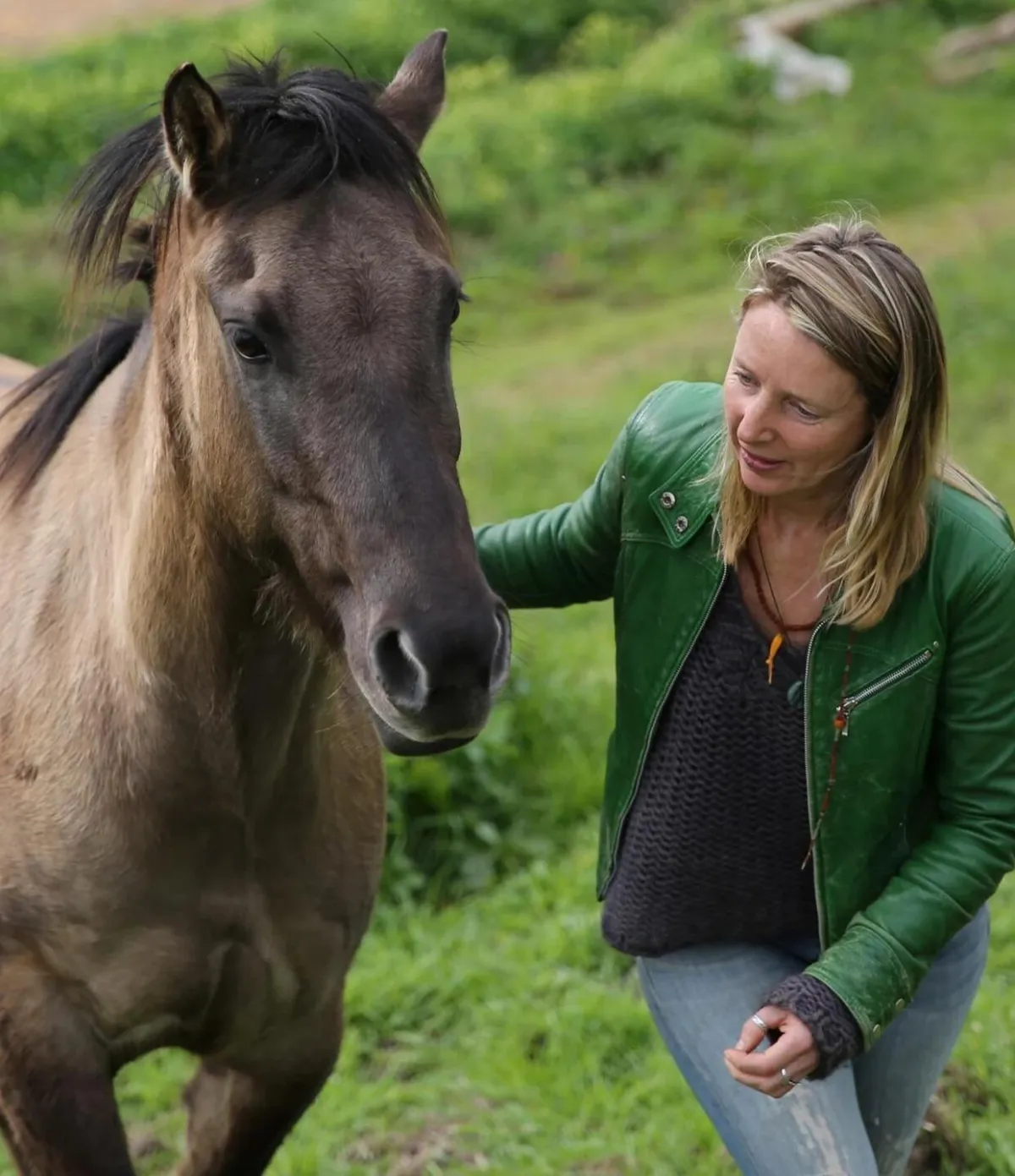 Woman looking at horse