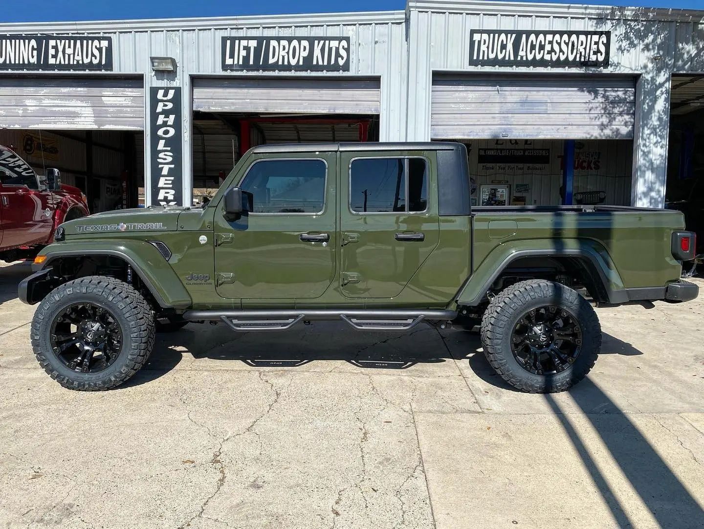 Lifted truck outside shop