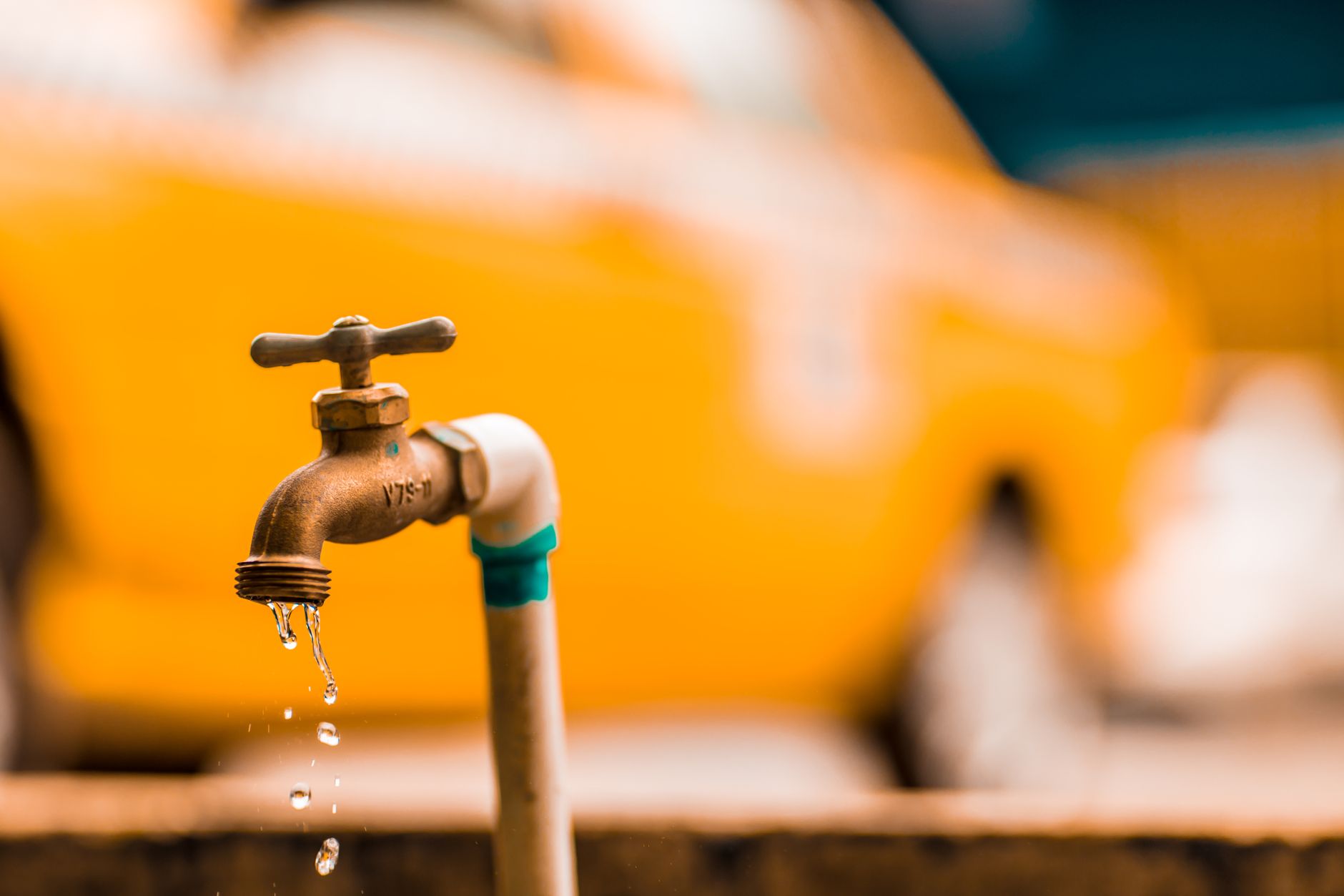 Plumber checking a water meter to find a hidden leak in Miami