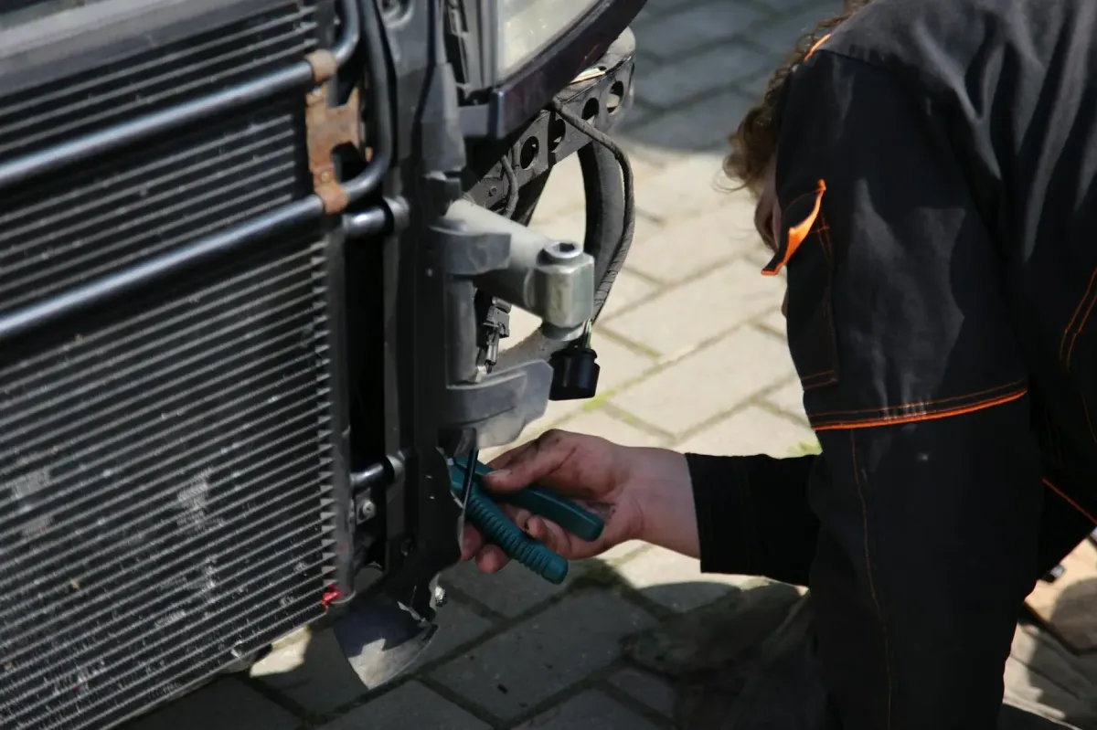 Technician resetting a garbage disposal motor