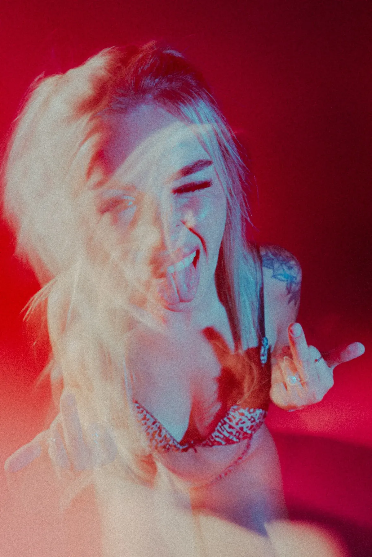 silhouette photo of three person near body of water during sunset