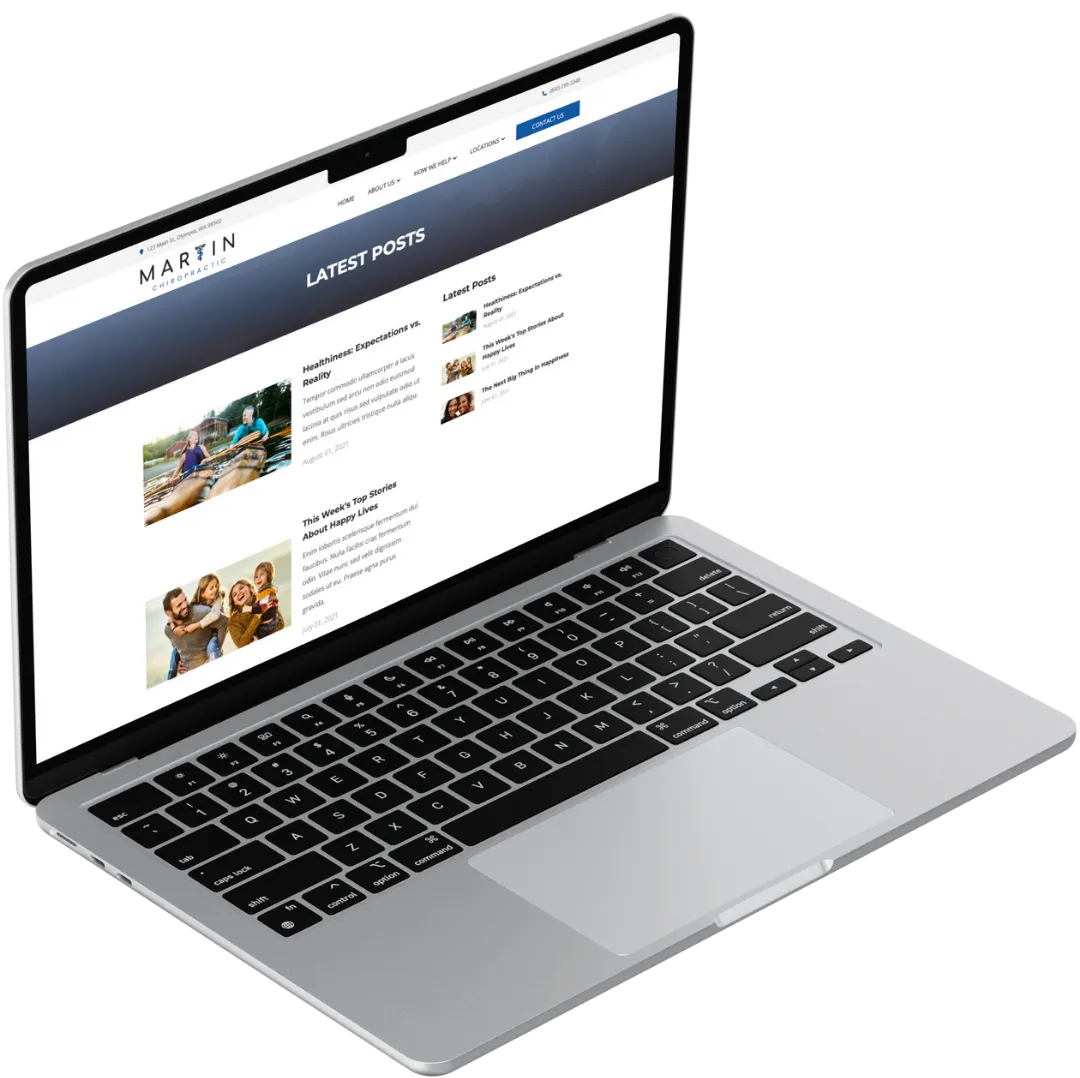 chiropractic website blog posts list on laptop