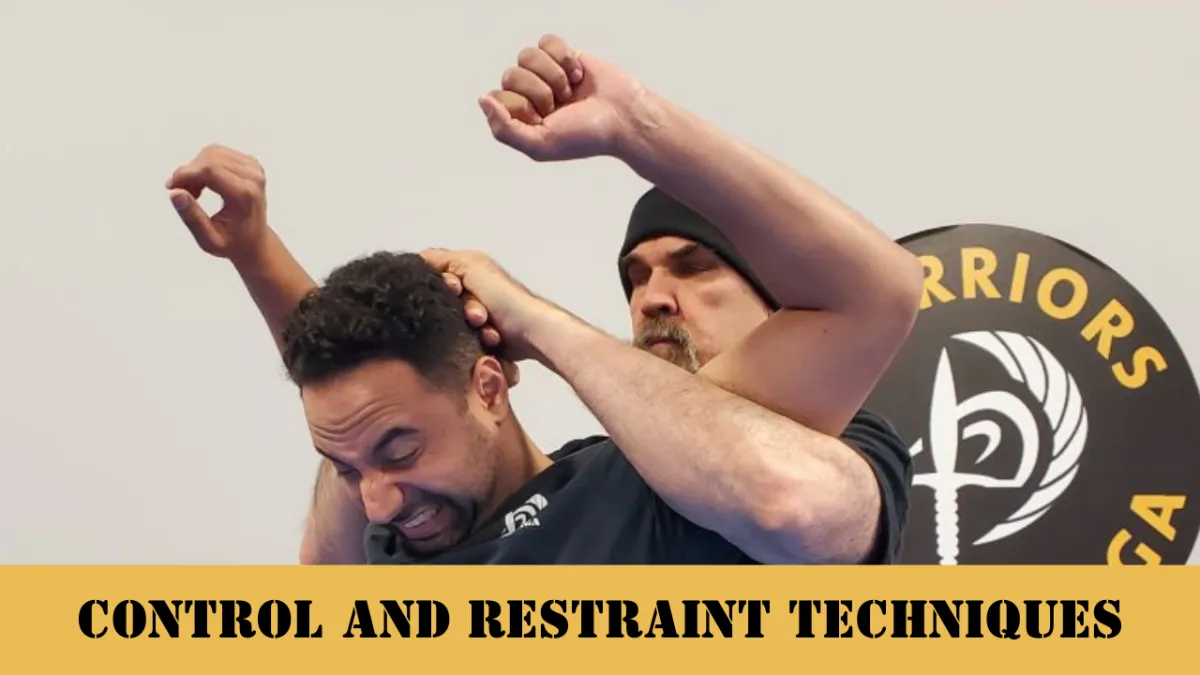 An image of Nick Hughes, head instructor of Krav Maga LKN in Cornelius, NC using control and restraint on someone.