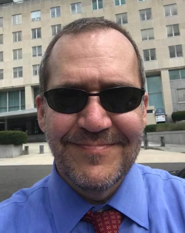 A picture of a former CIA officer who gave a testimonial saying this control and restraint course was better training than he received at the agency. 