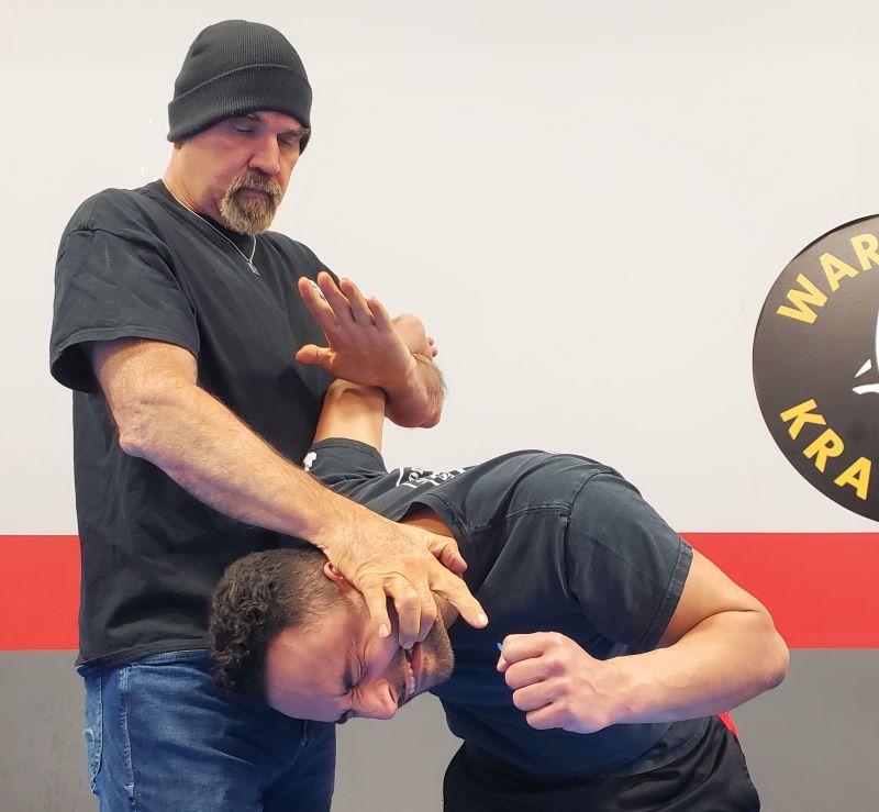 A picture of Nick Hughes, applying a control & restraint technique