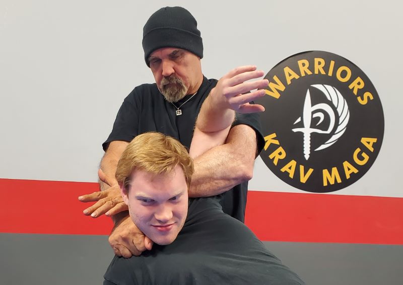 A picture of Nick Hughes doing a come along hold from his control & restraint course