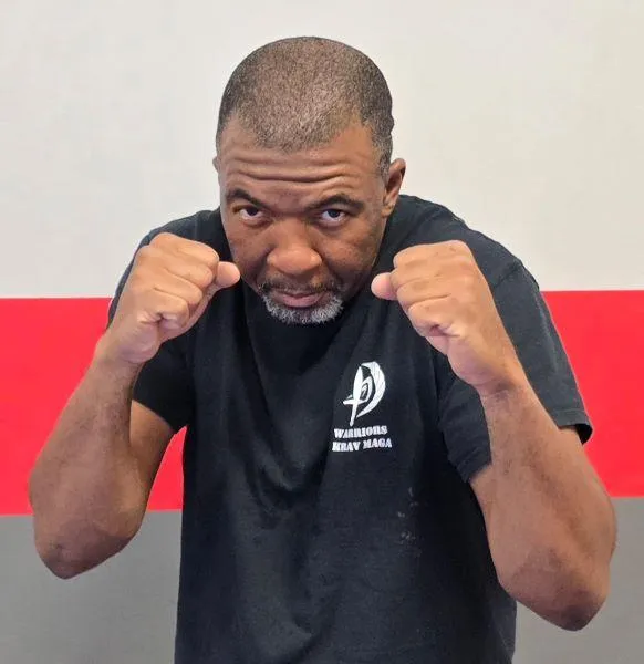 Adrian, an instructor at Warriors Krav Maga in a fighting stance.