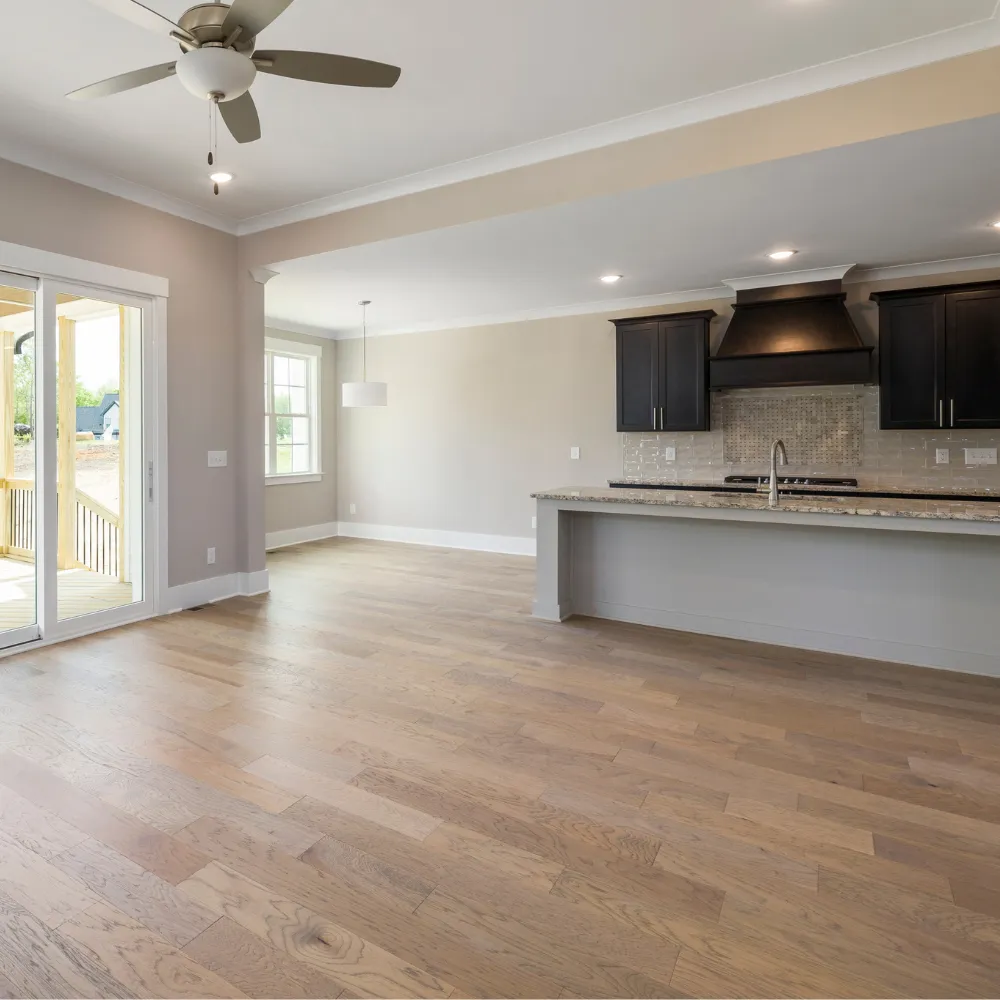 Spacious remodeled kitchen with granite countertops shaker cabinets hardwood floors and stainless steel appliances designed for modern family living