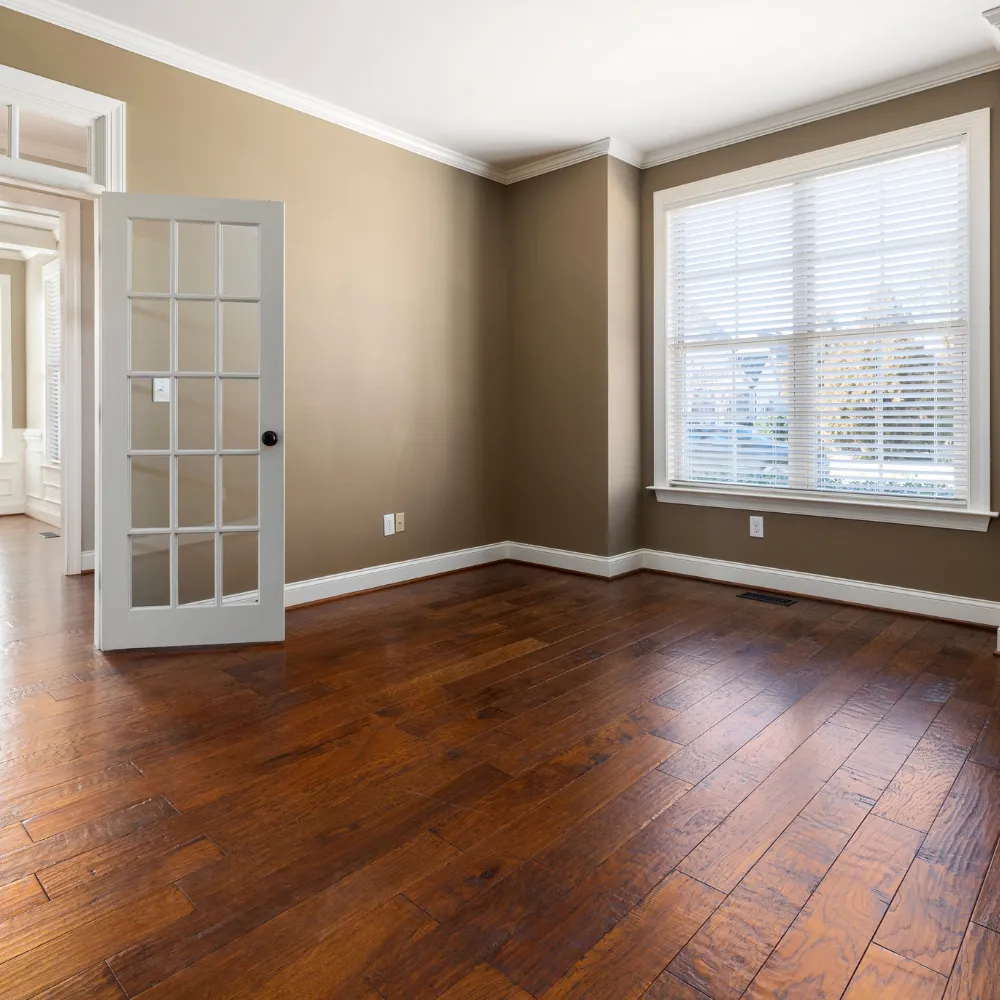 Elegant custom living room with open-concept design, stylish furnishings, and large windows for natural light and a welcoming atmosphere.