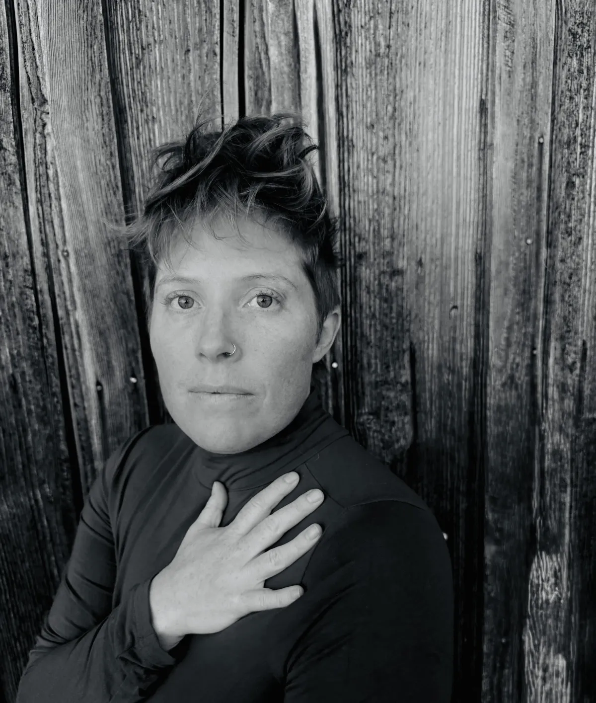 grayscale photo of man and woman holding their hands