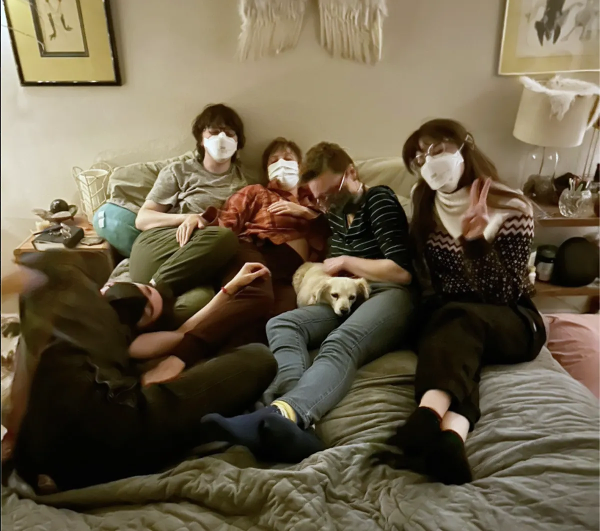 a group of children sitting on steps in front of a building